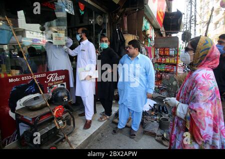 Additional Assistant Commissioner for Peshawar Cantonment, Gulshan Ara sealed the shops in different areas against the violating of SOPs, as a preventive measures against the spread of the coronavirus (COVID-19), in Peshawar on Thursday, June 4, 2020. The number of confirmed COVID-19 cases in Pakistan rose to 86,931 on Thursday after new infections were confirmed in the country. Stock Photo