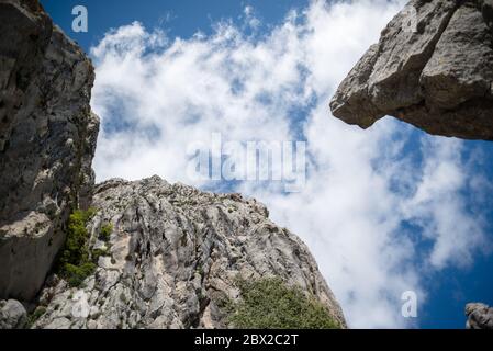 Low angle shot of the sky with clouds and limestone mountains in Andalusia, southern Spain. Stock Photo