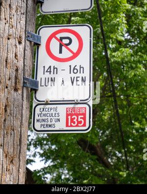 Montreal street no parking sign with exceptions for Local permit owners Stock Photo