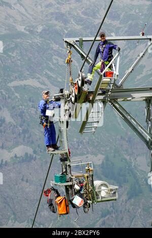 Switzerland Grisons Engadine touristic village of Sils-Maria, repairing Corvatsch cable-car Stock Photo