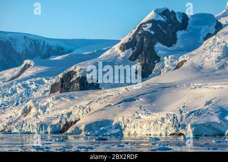 Antarctica, Southern Ocean, Antarctic Peninsula, Graham Land, Andvord Bay, Néko Harbor, ice floes and glaciers at sunrise Stock Photo