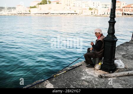 Old Fisherman at Chania Harbour, Crete Stock Photo