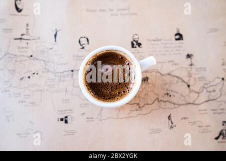 Top Down Image of Greek Coffee on a Table with a Map of Crete Stock Photo