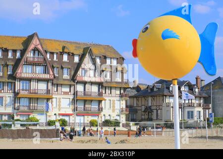 France, Calvados, Pays d'Auge, Trouville sur Mer, sign on the beach with beach club volleyball and the seafront in the background Stock Photo