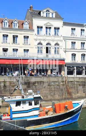 France, Calvados, Seine estuary, Pays d'Auge, Honfleur, Passenger wharf, fishing boat with the Café de Paris in the background Stock Photo