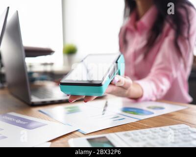 Woman helping pay credit card Stock Photo