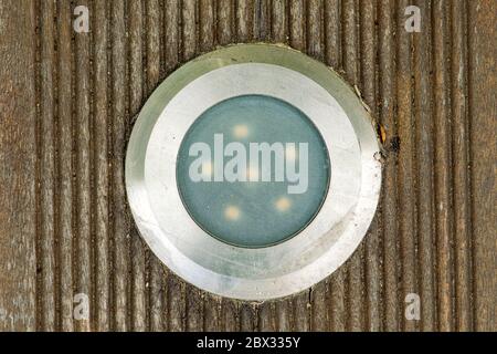Installation LED spotlight in the wooden terrace for outside Stock Photo