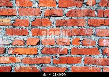 Brown brick wall. Empty horizontal background with old bricks and mortar. Stock Photo