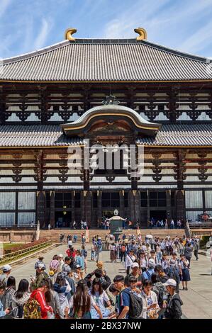 Nara / Japan - May 12, 2018: Tourists visiting the Todaiji Temple, landmark of Nara and one of most famous and historically significant Buddhist templ Stock Photo