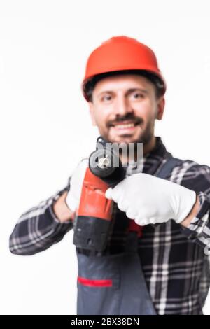 Handsome builder in uniform with tool belt holding drill isolated on white Stock Photo