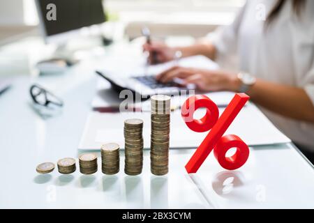 Percentage Sign And Discount Rate. Accountant Signing Invoice Stock Photo
