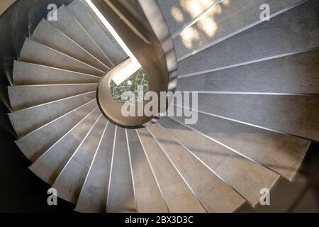 Bangkok, Thailand - May 15, 2020 : Upside view of a spiral staircase pattern. Spiral stairs circle in courtyard architecture. Outdoor ladder decoratio Stock Photo