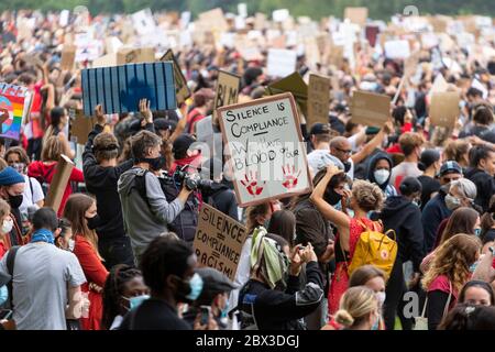 Signs held above the crowd at the Black Lives Matters protest in Hyde Park, London, 3 June 2020 Stock Photo