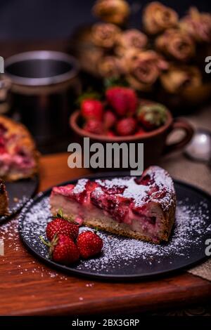 Organic homemade strawberry and rhubarb cake. Sweet food. Sweet dessert. Close up, selective focus. Stock Photo