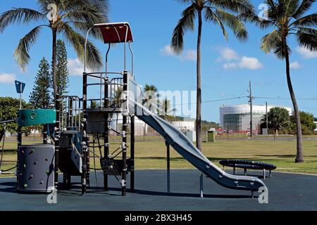 Slippery slide and play equipment in childrens outdoor playground, no-one to play Stock Photo