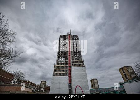Charred remains of Grenfell Tower - 24-storey residential tower block in London, destroyed by severe fire in July 2017. Picture taken on 18/02/20018 Stock Photo