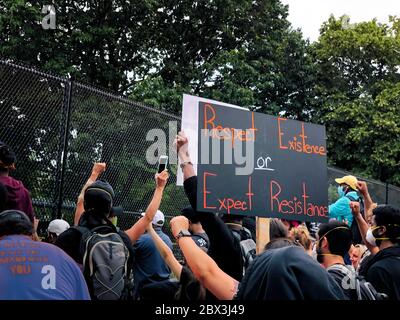 Washington, DC, USA - June 2, 2020: Protesters raise signs and hands at White House demonstration against the murder of George Floyd by police Stock Photo