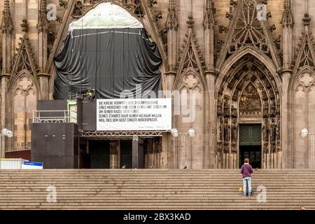 Inscription on the Cologne Cathedral citing II Vatican Council 'Nostra aetate' 1965 and expressing equal rights for all people On the facade of the Cologne Cathedral, Germany Stock Photo