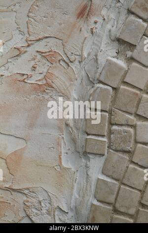 Texture of beige. Textured background. Decorative plaster walls, external decoration of facade. Stock Photo