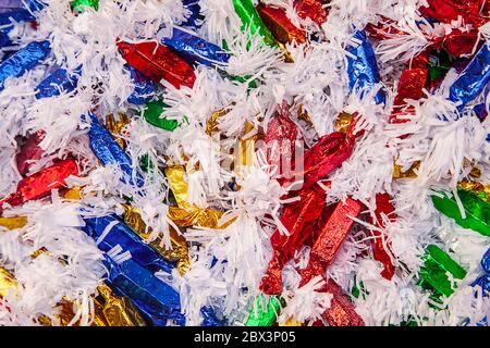 Wrapped bonbons background.  Christmas Tree and Easter Candies Close Up - Image Stock Photo