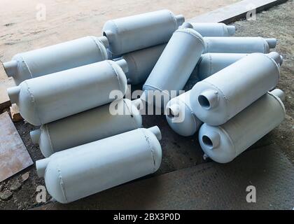 Grey flow through air collector tanks on the ground. Industry concept. Stock Photo