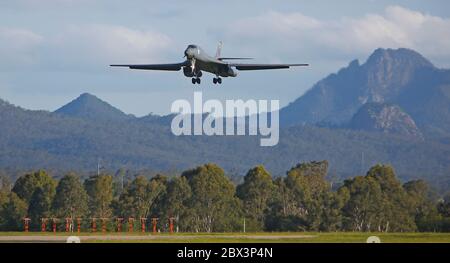 A U.S. Air Force B-1B Lancer stealth bomber aircraft from the 37th Expeditionary Bomber Squadron, 28th Bomb Wing, lands at Royal Australian Air Force Base Amberley November 27, 2017 in Amberley, Australia. Two B-1B Lancers are participating in RAAF-led exercise Lightning Focus, the largest international air forces exercise in Australia. Stock Photo