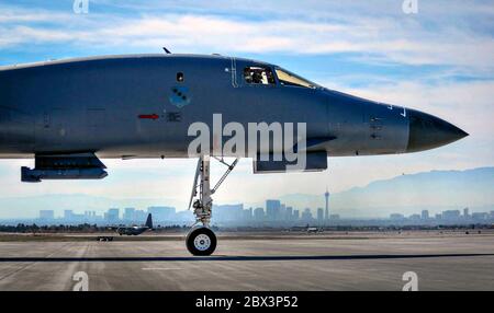 A U.S. Air Force B-1B Lancer stealth bomber aircraft from the 28th Bomb Wing, begins to taxi down the runway for take-off during Red Flag 16-1 at Nellis Air Force Base January 29, 2016 in Las Vegas, Nevada. Stock Photo