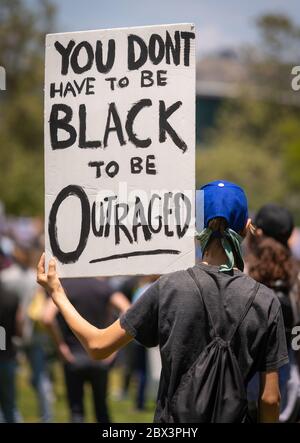 Protester with sign at demonstration honoring George Floyd, at Pan Pacific Park in the Fairfax neighborhood of Los Angeles, California. Stock Photo