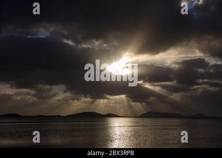 Dramatic light over the ocean at Albany in Western Australia at dawn Stock Photo