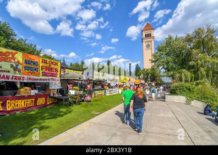 Tourists enjoy food stalls and booths at the annual Pig out in the Park Festival in Spokane, Washington. Stock Photo