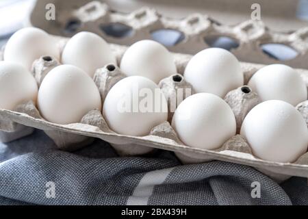 Twelve eggs in a carton package Stock Photo