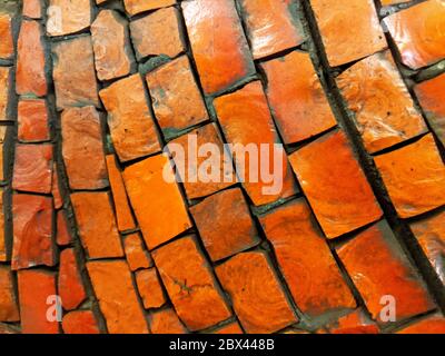 Terracotta brick wall pattern detail abstract background Stock Photo