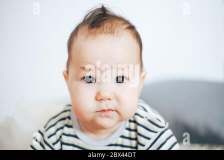 portrait of unhappy baby crying out loud Stock Photo