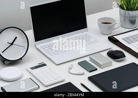 Flat lay of office desktop and gadgets Stock Photo