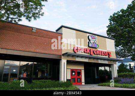 A logo sign outside of a Chuck E. Cheese location in Annapolis, Maryland on May 25, 2020. Stock Photo