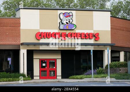 A logo sign outside of a Chuck E. Cheese location in Annapolis, Maryland on May 25, 2020. Stock Photo