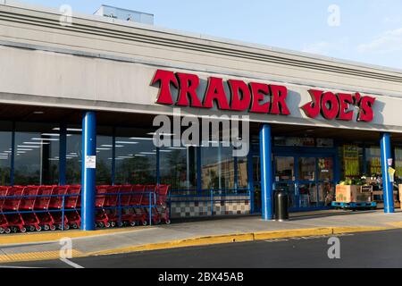 A logo sign outside of a Trader Joes retail grocery store location in Annapolis, Maryland on May 25, 2020. Stock Photo