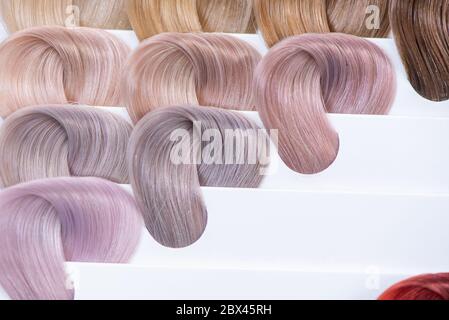 Hair color chart. Palette of dyed bright shiny hair samples. Catalog for selection in a beauty salon Stock Photo