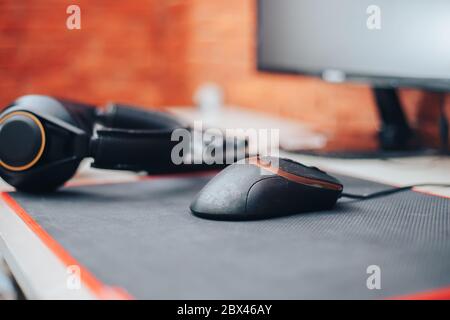 Gaming arena background with mouse gear headphones computer, focuse on mouse selected focuse Stock Photo