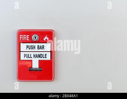 Red box of fire alarm on wall Stock Photo