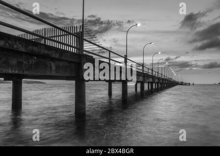 scenery of jetty sunset at Kota Kinabalau, Sabah in soft focus,motion blur due to long exposure Stock Photo