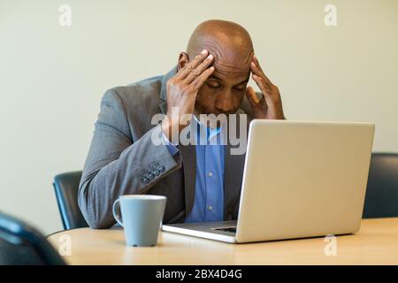 African American man having a difficult time at work. Stock Photo