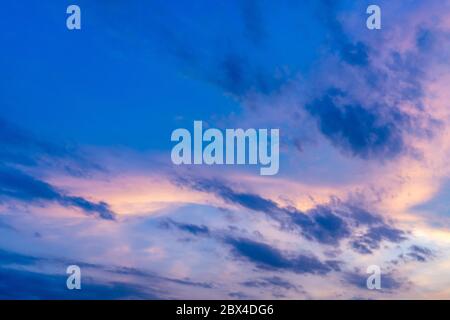 Twilight sky with fluffy cloud in summer evening Stock Photo