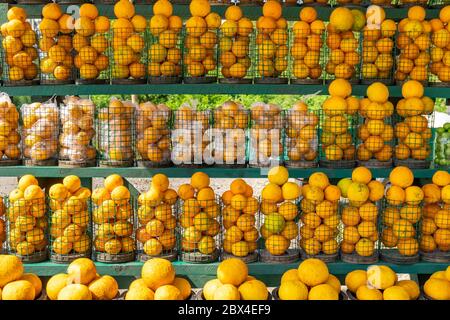 Oranges for sale in baskets, outdoor market Stock Photo