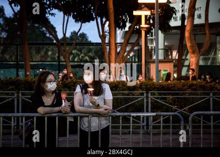 Hong Kong, China. 04th June, 2020. People hold their candles during the 31st Anniversary of the Tiananmen Massacre. Thousands gathered for the annual memorial vigil in Victoria Park to mark the 1989 Tiananmen Square Massacre despite a police ban citing coronavirus social distancing restrictions. Credit: SOPA Images Limited/Alamy Live News Stock Photo