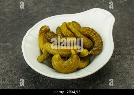 Pickled young gherkin in the bowl Stock Photo