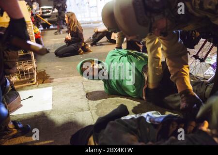 Beijing, USA. 30th May, 2020. Riot police officers arrest a small group of protesters at a memorial to George Floyd in Minneapolis, the United States, May 30, 2020. TO GO WITH XINHUA HEADLINES OF JUNE 5, 2020 Credit: Angus Alexander/Xinhua/Alamy Live News Stock Photo