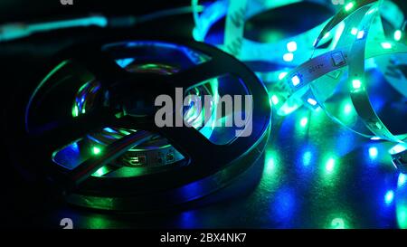 Diode strip for decoration of interiors. Led lights tape. Blue color on dark Stock Photo