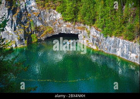 Boat on marble canyon with water at summer in Ruskeala, Karelia, Russian Federation Stock Photo