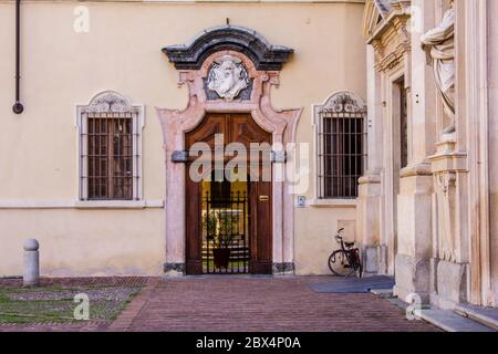 Door on the Right Side of San Giovanni Evangelista Church, Parma, Italy Stock Photo
